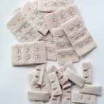 Beige hook & eye closures (3x2, 3x3)