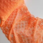 Pizzo arancione elasticizzato per lingerie e reggiseni
