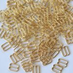 Reguladores de metal dorado claro 10mm para sujetadores | Set de 2 piezas